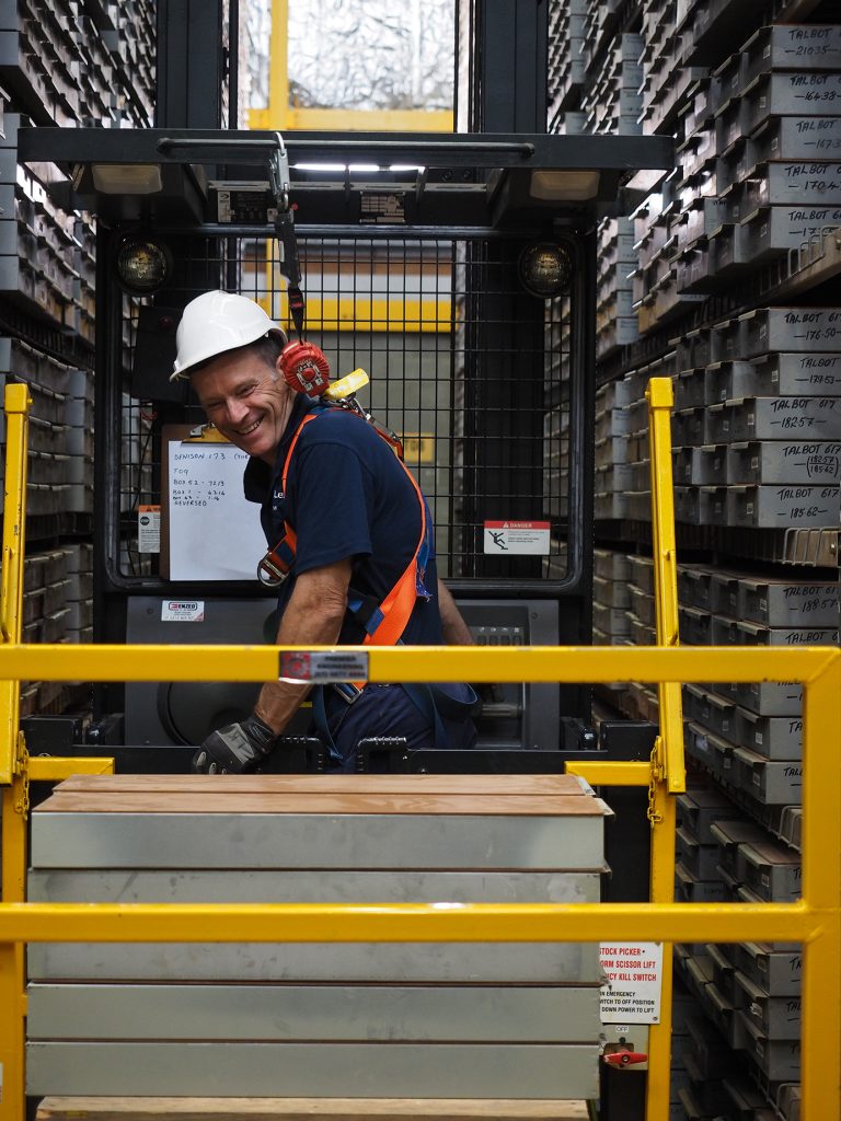 Senior Field Hand, Lex Klein, uses a high lift machine to retrieve boxes of geological core from the core library at the Exploration Data Centre (EDC).