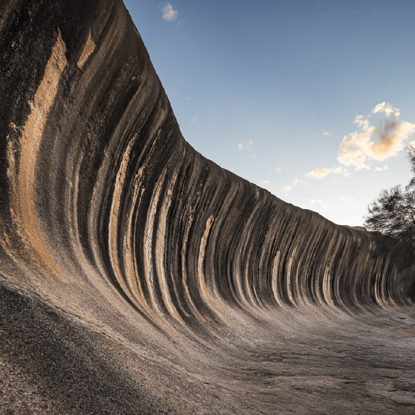 Wave Rock, a 15 metre high natural rock formation that is shaped like a tall breaking ocean wave and is located at Hyden in Western Australia